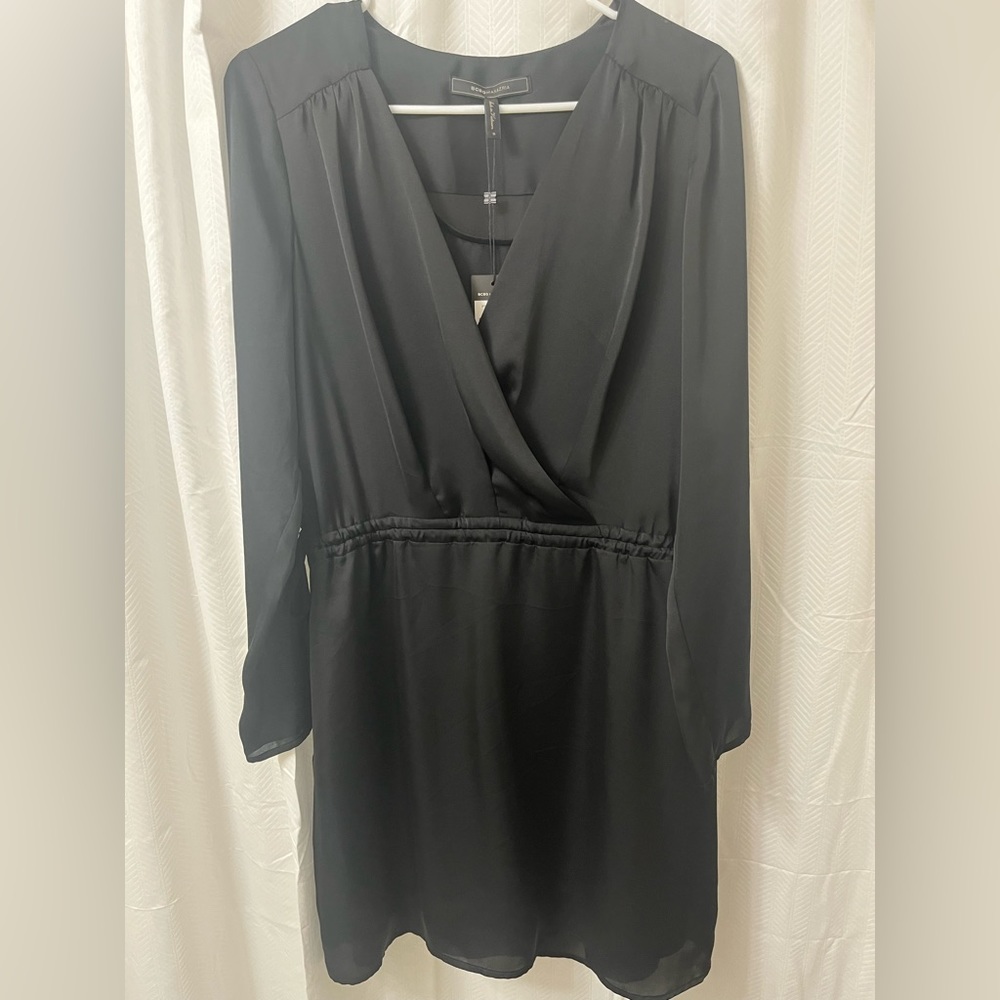 BCBG MAXAZRIA v-neck ,Long sleeve black dress. Length right above the knee.